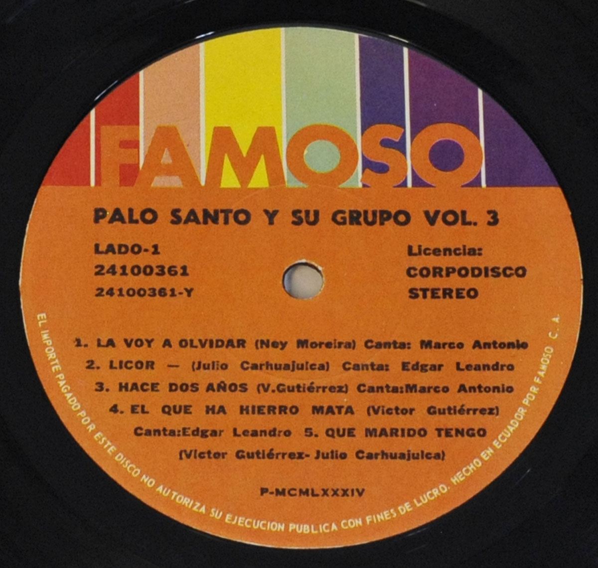Colorful Famoso label on Side 1 of Palo Santo y Su Grupo Vol. 3, with song titles, composers, and singers printed on an orange background and rainbow header.